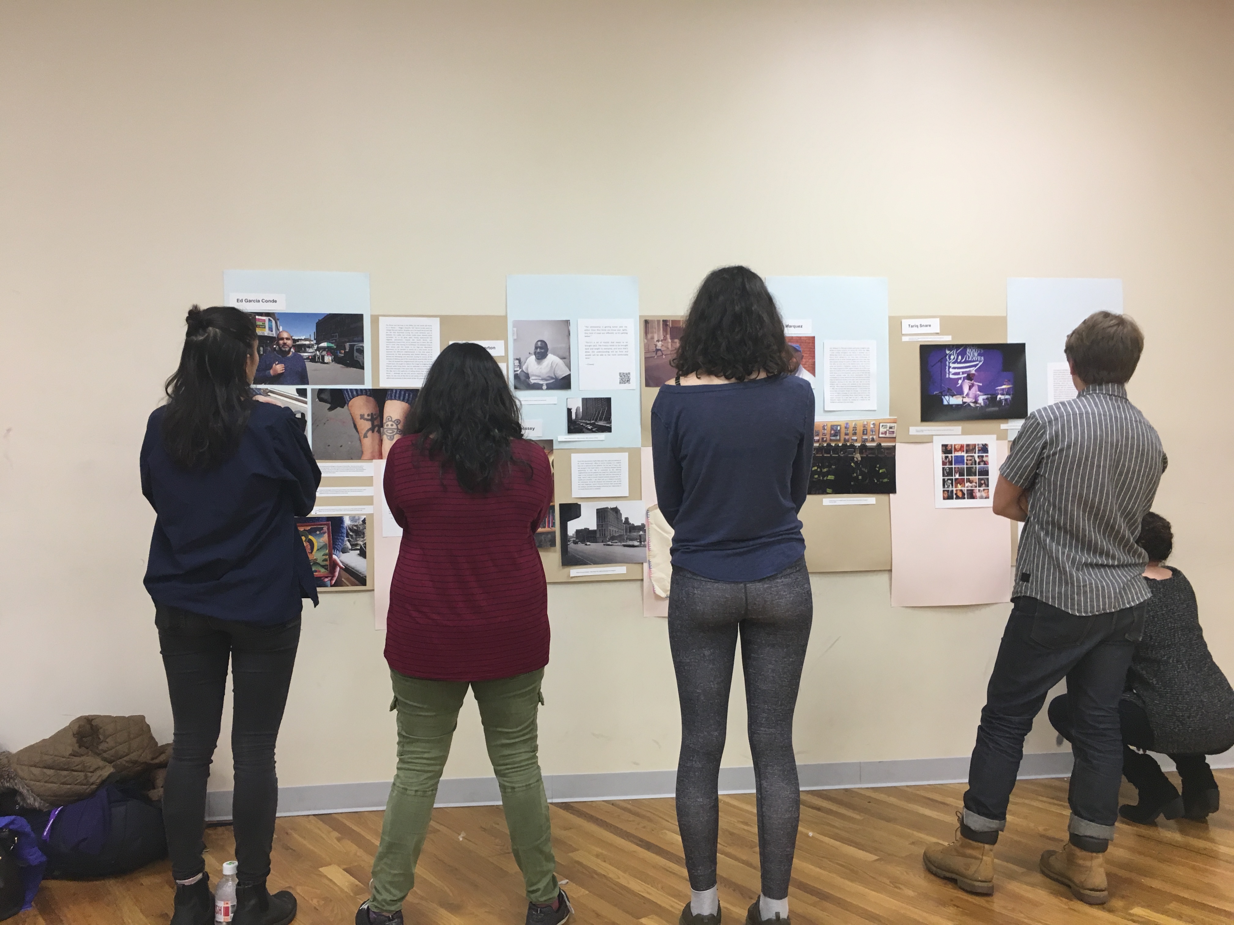 Students standing in front of their exhibit for Melrose Oral History Project, Spring 2017